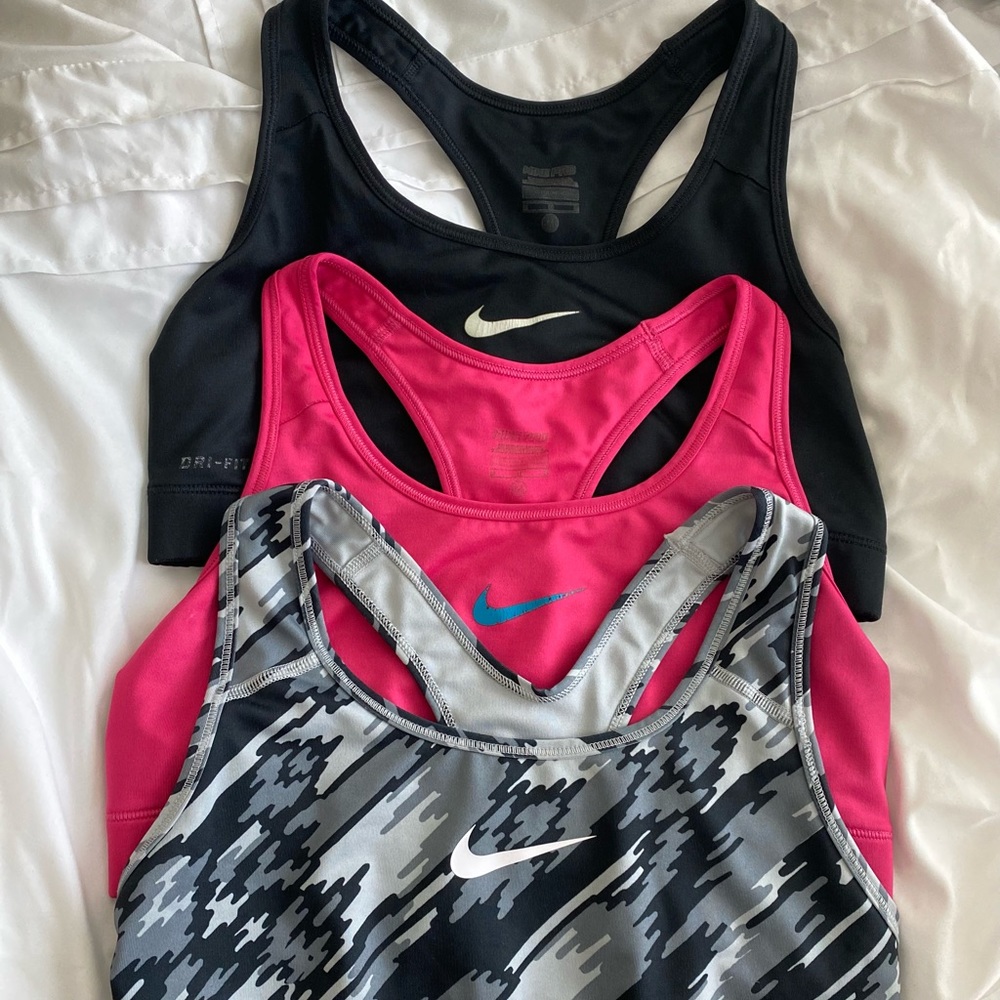 Three Nike Dri-Fit sports bras size M gently used. Accepting reasonable offers.